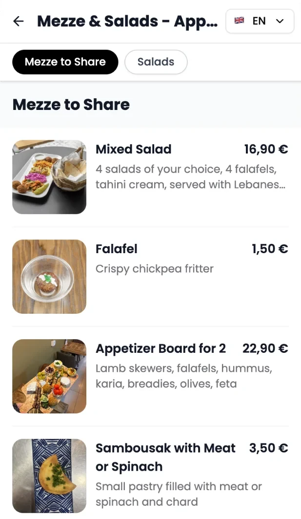 Le 13 juillet 2026, la carte Mezze & Salads s’affiche en anglais avec les photos d’origine du restaurant : Mixed Salad à 16,90 €, Falafel, Appetizer Board for 2 et Sambousak.